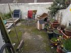 Cluttered, nasty back yard Brighton
